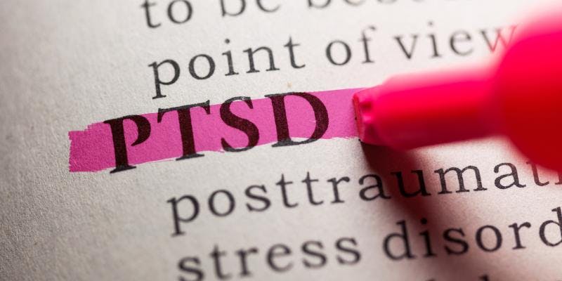 A close up of the dictionary showing the definition of PTSD.