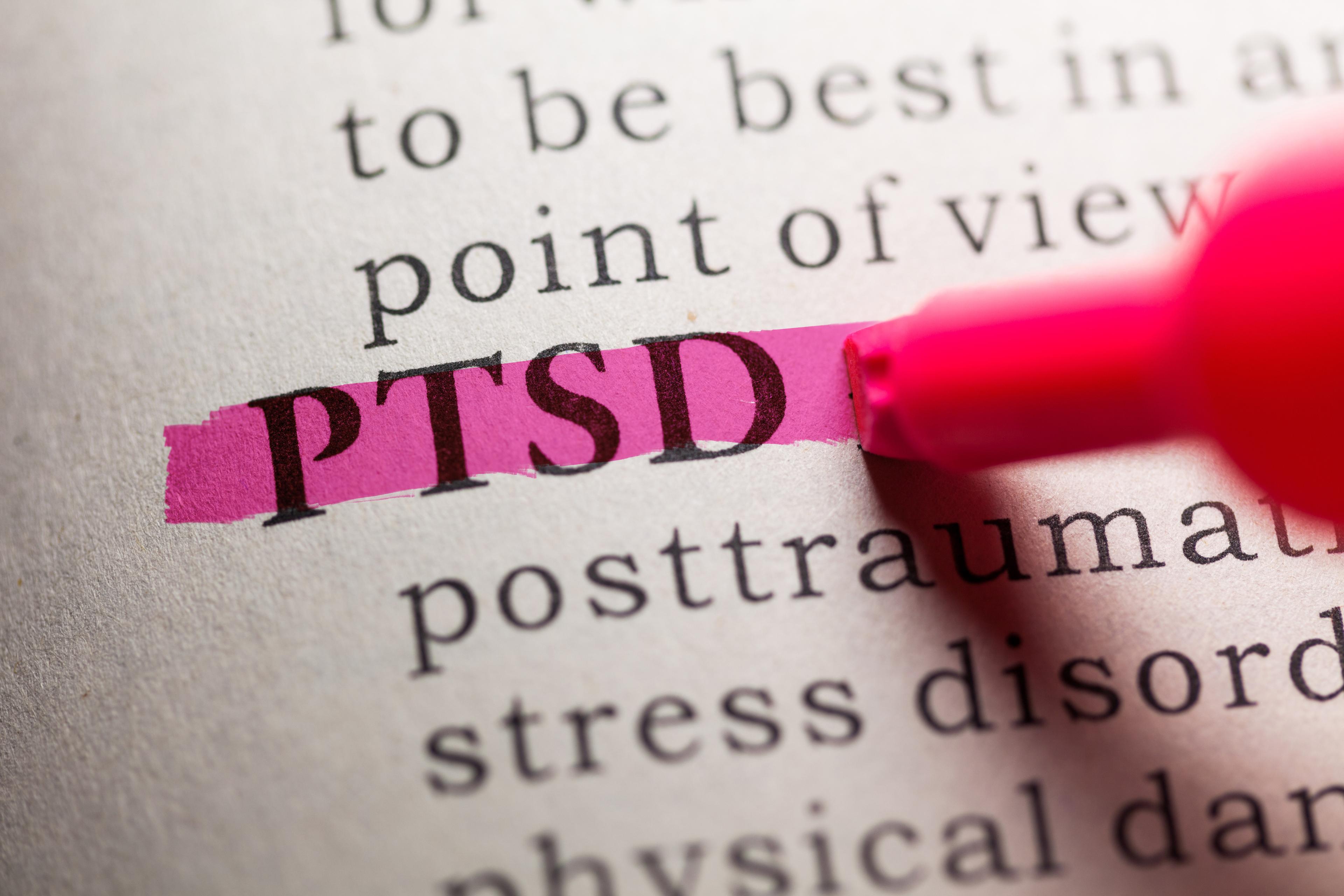 A close up of the dictionary showing the definition of PTSD.