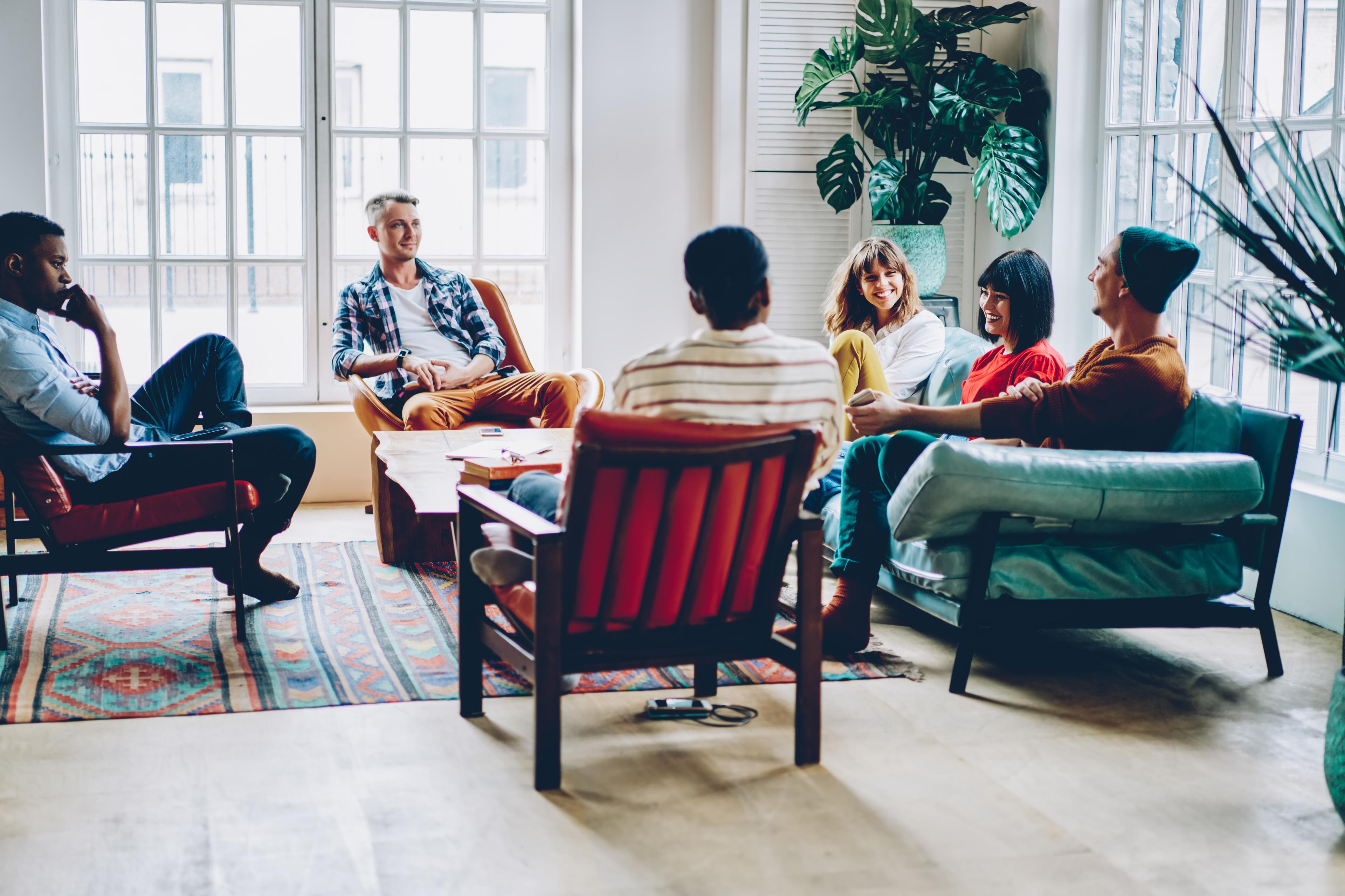 6 people meeting for a mutual peer support group