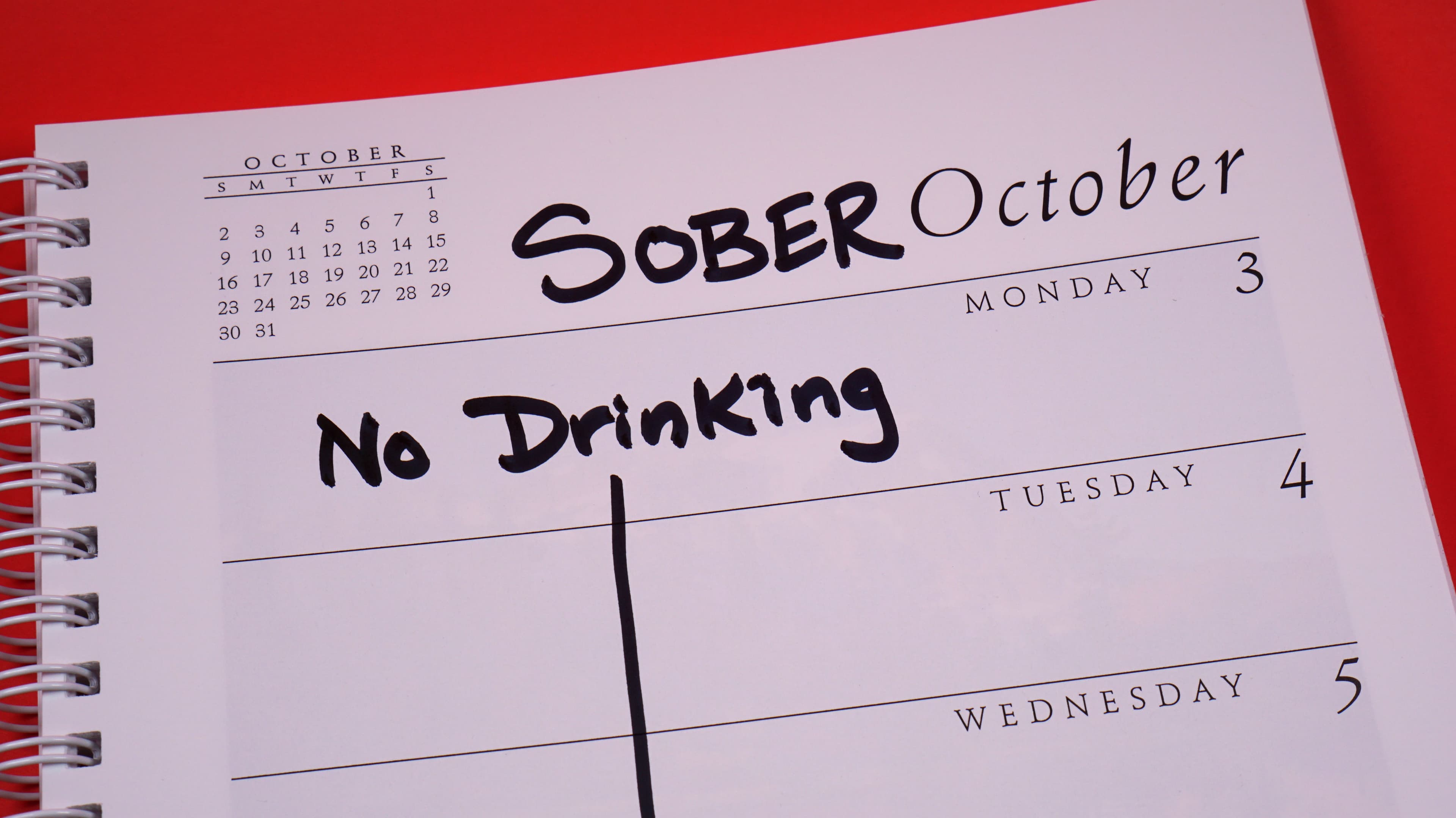 Picture of a calendar showing the month of October. There is an entry, spanning the whole month, that says "No Drinking".